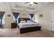 Spacious main bedroom with tray ceiling, neutral walls, and dark wood furniture at 59 Summer Nw Pl, Cartersville, GA 30121