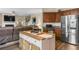 Open-concept living area featuring a kitchen island, stainless appliances, and a cozy living room at 59 Summer Nw Pl, Cartersville, GA 30121