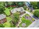 Two-story brick home with a well-manicured lawn and garden with mature shade trees at 1885 Vintage Dr, Snellville, GA 30078
