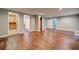 Large basement area with hardwood flooring and several doorways at 1885 Vintage Dr, Snellville, GA 30078