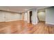 Spacious finished basement with hardwood floors, recessed lighting, and neutral paint at 1885 Vintage Dr, Snellville, GA 30078