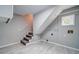Finished basement area featuring stairs and gray vinyl floors at 1885 Vintage Dr, Snellville, GA 30078