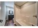 Bathroom featuring a dark vanity and white bathtub shower combo at 1885 Vintage Dr, Snellville, GA 30078
