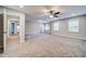 Spacious bedroom featuring carpet floors, ceiling fan, neutral paint, and great natural light at 1885 Vintage Dr, Snellville, GA 30078