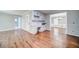 Open concept dining area with hardwood floors, light gray walls, and white wainscoting at 1885 Vintage Dr, Snellville, GA 30078