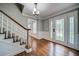 Welcoming foyer with hardwood floors, staircase, and elegant decorative touches at 1885 Vintage Dr, Snellville, GA 30078