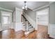 Spacious foyer with hardwood floors and a staircase, leading to the upper level at 1885 Vintage Dr, Snellville, GA 30078
