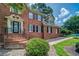 Elegant brick home with a welcoming front entrance and beautifully landscaped surroundings at 1885 Vintage Dr, Snellville, GA 30078