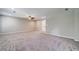 Spacious living room featuring a ceiling fan, neutral paint, plush carpeting and great natural light at 1885 Vintage Dr, Snellville, GA 30078