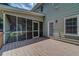 Cozy screened porch with a wooden deck, offering a serene outdoor living space at 1885 Vintage Dr, Snellville, GA 30078