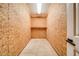 Small storage space featuring plywood walls, one shelf, and a concrete floor at 1885 Vintage Dr, Snellville, GA 30078