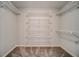Walk-in closet with multiple wire rack shelves for organization at 1885 Vintage Dr, Snellville, GA 30078