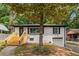 Charming white-brick home with newly built stairs and a well-maintained front yard at 208 Silver Springs Sw Cir, Atlanta, GA 30310