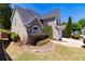 Charming two-story home with a manicured front lawn, two-car garage, and beautiful landscaping at 2103 Drogheda Ln, Marietta, GA 30066