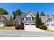 Charming home with a two-car garage and manicured landscaping at 2103 Drogheda Ln, Marietta, GA 30066