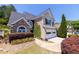 Charming two-story home with a manicured front lawn, two-car garage, and mature landscaping at 2103 Drogheda Ln, Marietta, GA 30066
