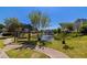 Community pond view with fountain, swing set, and walking path at 2103 Drogheda Ln, Marietta, GA 30066