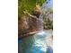Tranquil pool featuring stone waterfall at 2103 Drogheda Ln, Marietta, GA 30066