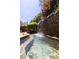 Tranquil pool featuring stone waterfall at 2103 Drogheda Ln, Marietta, GA 30066