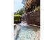 Tranquil pool featuring stone waterfall at 2103 Drogheda Ln, Marietta, GA 30066