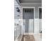 Charming gray front door with transom window and stylish welcome mat at 3980 Riverlook Se Pkwy # 203, Marietta, GA 30067