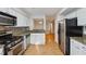 Modern kitchen with stainless steel appliances and speckled granite countertops at 3980 Riverlook Se Pkwy # 203, Marietta, GA 30067