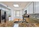 Bright kitchen featuring stainless steel appliances, granite countertops, and tile backsplash at 3980 Riverlook Se Pkwy # 203, Marietta, GA 30067