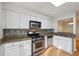 Well-equipped kitchen with stainless steel appliances and granite countertops at 3980 Riverlook Se Pkwy # 203, Marietta, GA 30067