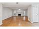 Expansive living area featuring a fireplace, windows, and a nearby white entry door at 3980 Riverlook Se Pkwy # 203, Marietta, GA 30067