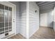 Covered patio with gray wood planks, a glass door, and exterior light fixture at 3980 Riverlook Se Pkwy # 203, Marietta, GA 30067