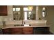 A kitchen featuring stainless steel appliances, warm wood cabinets, and modern neutral countertops at 1213 Dawnview Dr, Locust Grove, GA 30248