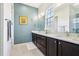 Bathroom featuring a double vanity with modern fixtures, quartz counters, and a well-lit mirror at 215 Britten Pass, Alpharetta, GA 30009