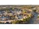 An aerial view of a residential neighborhood with well-maintained houses and tree-lined streets, offering a peaceful suburban lifestyle at 4058 Rosebay Way, Conyers, GA 30094