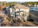 Aerial view of the home showcasing the deck, patio, and landscape at 4058 Rosebay Way, Conyers, GA 30094