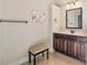Well-lit bathroom showcasing dark wood cabinets and neutral walls at 4058 Rosebay Way, Conyers, GA 30094