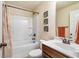 Bathroom featuring a tub with shower, toilet, sink, and dark wooden vanity at 4058 Rosebay Way, Conyers, GA 30094