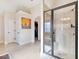 Luxurious bathroom offering a glass-enclosed shower, tile floors, and stylish fixtures at 4058 Rosebay Way, Conyers, GA 30094