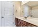 Bathroom showcasing vanity with sink and a mirrored reflection of the shower-tub and door at 4058 Rosebay Way, Conyers, GA 30094