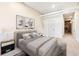 Bright bedroom featuring a bed, two side tables, and art at 4058 Rosebay Way, Conyers, GA 30094