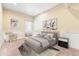 Bright bedroom featuring a bed, two side tables, and art at 4058 Rosebay Way, Conyers, GA 30094