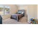 Bright bedroom with a large window and a comfortable bed at 4058 Rosebay Way, Conyers, GA 30094
