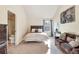 Cozy bedroom featuring a queen bed, plush couch, and neutral tones for a relaxing atmosphere at 4058 Rosebay Way, Conyers, GA 30094