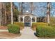 A charming gazebo, nestled amongst mature trees and shrubs, offering a peaceful retreat in a serene community setting at 4058 Rosebay Way, Conyers, GA 30094