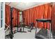 Home gym with workout equipment including a weight rack, bench, treadmill, and stationary bike at 4058 Rosebay Way, Conyers, GA 30094