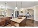 Kitchen featuring granite countertops and islands that flow to the adjacent living area at 4058 Rosebay Way, Conyers, GA 30094