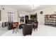 Spacious living room featuring a fireplace, flat screen TV, bar area, and comfortable seating at 4058 Rosebay Way, Conyers, GA 30094