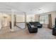 Spacious living area with staircase, plush seating, and abundant natural light at 4058 Rosebay Way, Conyers, GA 30094