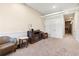Living room with a fireplace and two armchairs at 4058 Rosebay Way, Conyers, GA 30094