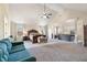 Bright, open primary bedroom featuring a large bed, sitting area, and soaring ceilings at 4058 Rosebay Way, Conyers, GA 30094
