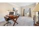 Office space with neutral walls, carpet flooring, and natural light at 4058 Rosebay Way, Conyers, GA 30094